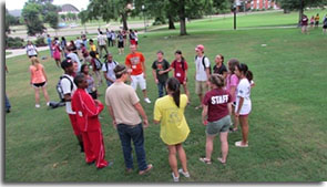 students standing in a circle and talking